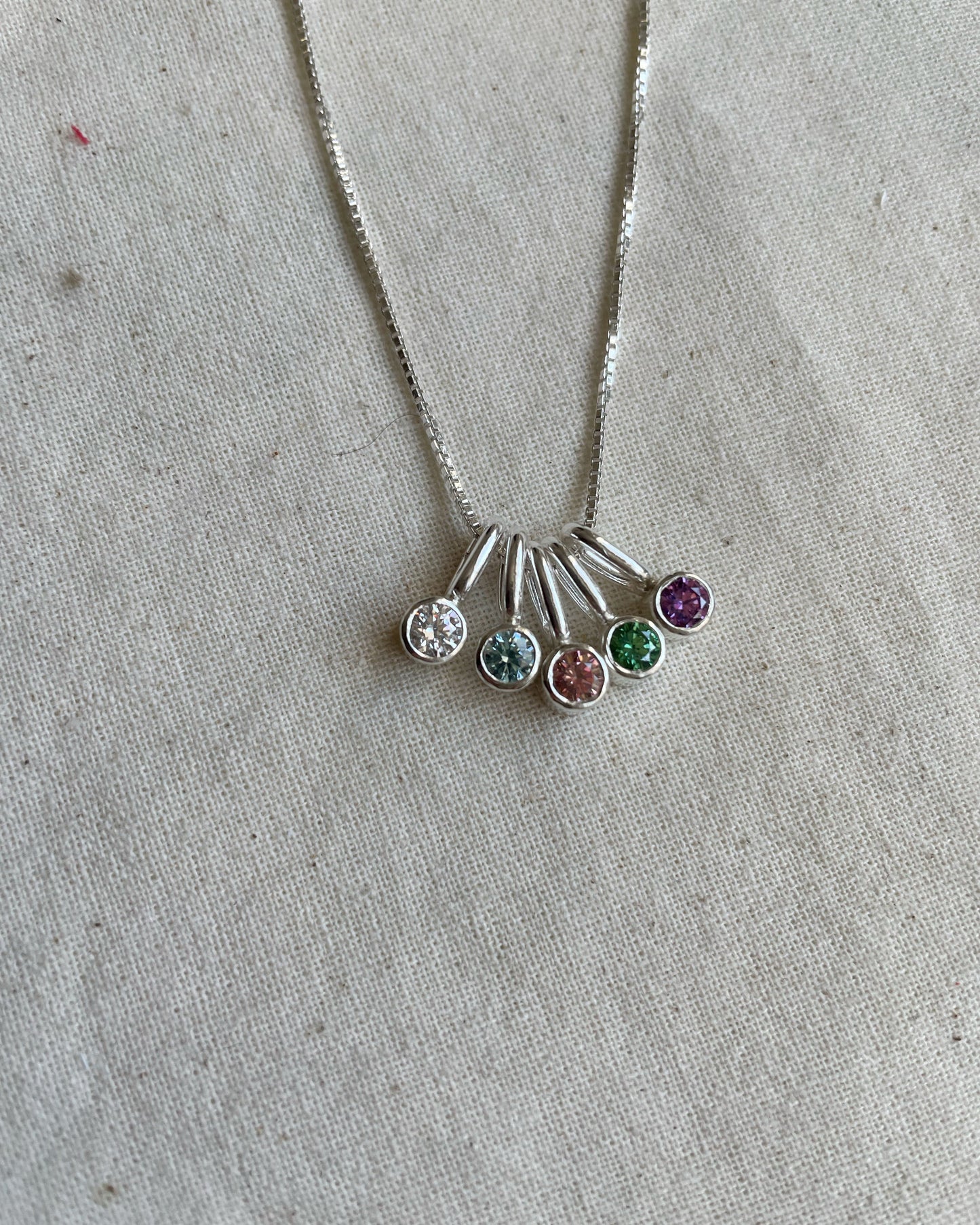 Mini Charm Punto de Luz de plata con circón